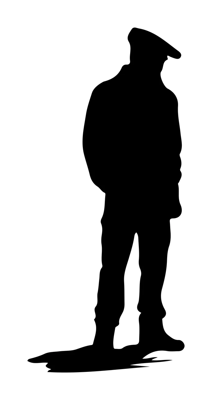 Full Length Silhouette Of A Standing Person Wearing cap coat